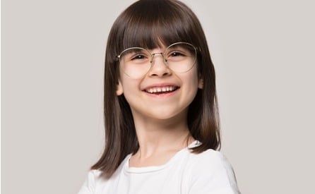 funny little girl wearing glasses with round big spectacle frame picture id1157139752